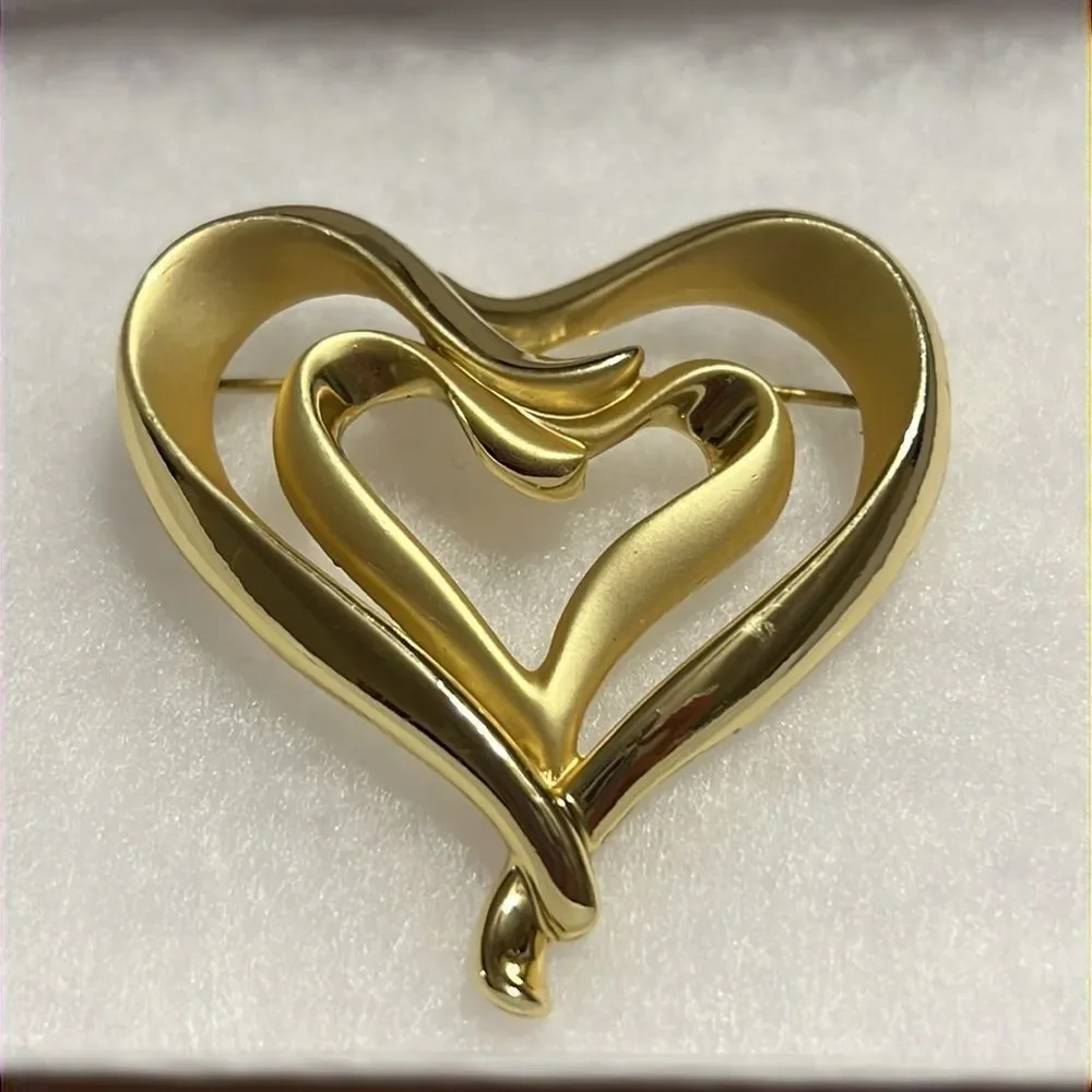 Elegant Golden AJC Brooch with Dual Hearts